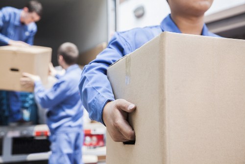 Moving van and packed boxes for house removals in Erith