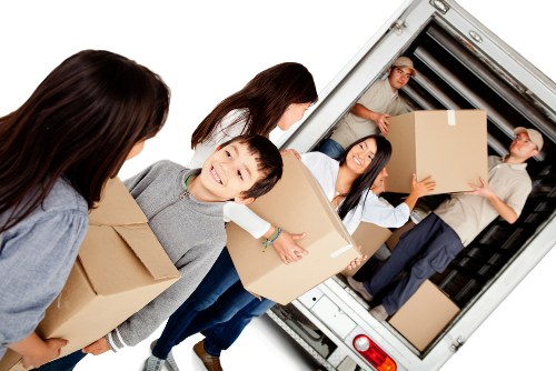 Small removals van handling furniture in Erith