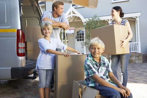 Packed boxes and furniture ready for man and van transport