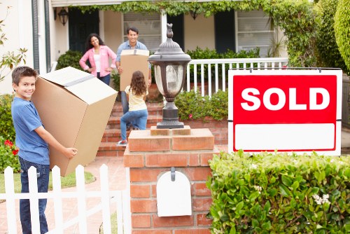 Furniture and boxes from a flat or terrace property being assessed for storage